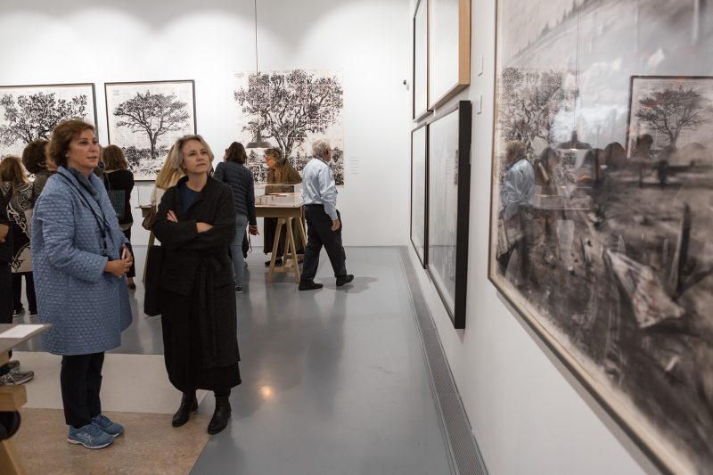 Sandra admiring artworks alongside Mary Corigall