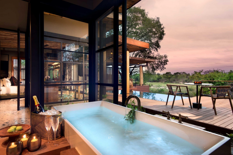 Picture of &Beyond Tengile River Lodge’s enormous bathroom which allow for great views